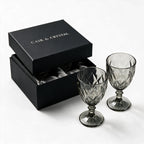 Nocturne black cocktail glass with diamond cut facets and a short stem