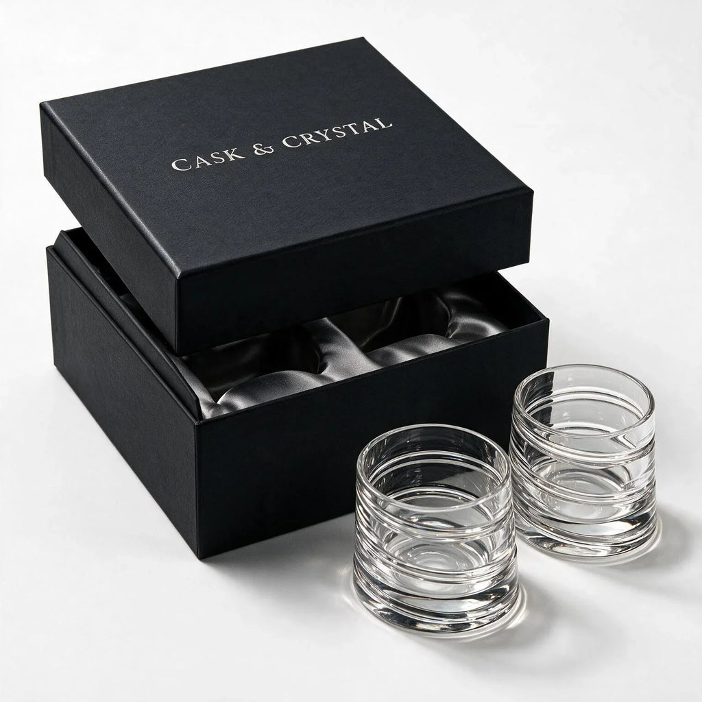 Helix clear whisky glass with a slanted rim and sweeping textured design