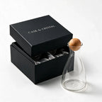 Orla clear glass decanter with a spherical wooden stopper
