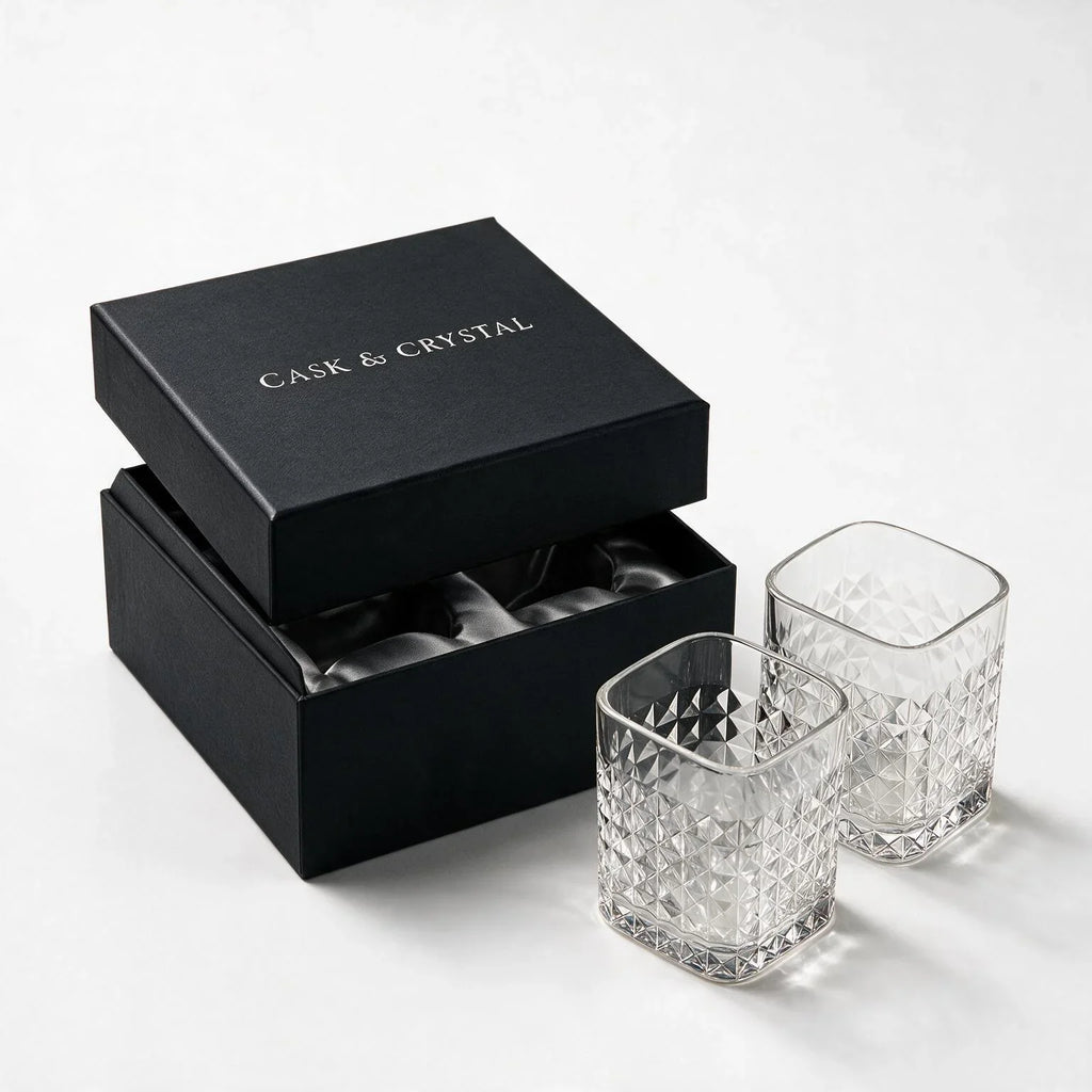 Astor clear whisky glass with diamond cut facets and a square base