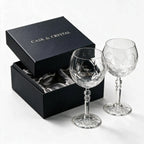Lumina clear cocktail glass with a tall stem and geometric diamond cut bowl