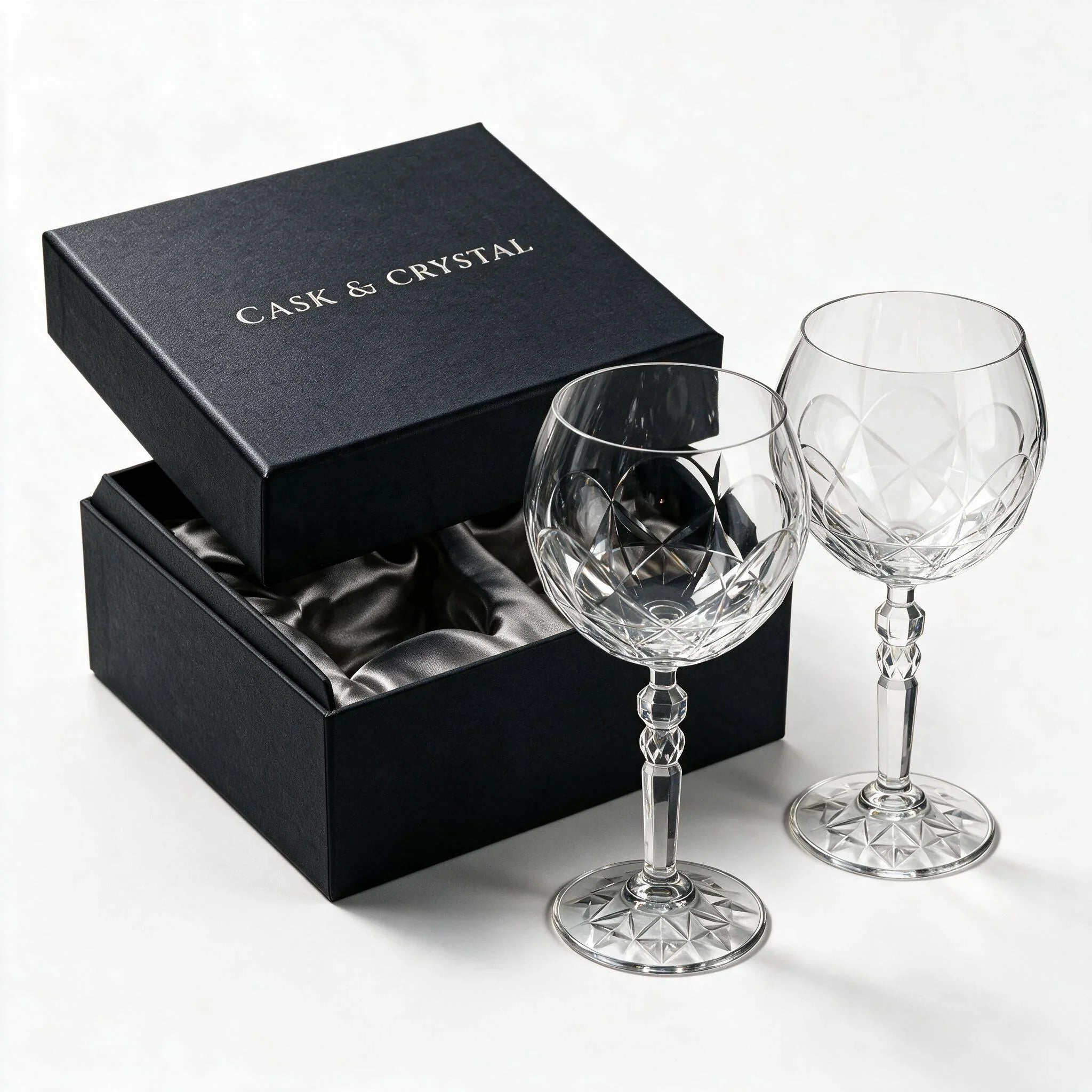 Lumina clear cocktail glass with a tall stem and geometric diamond cut bowl