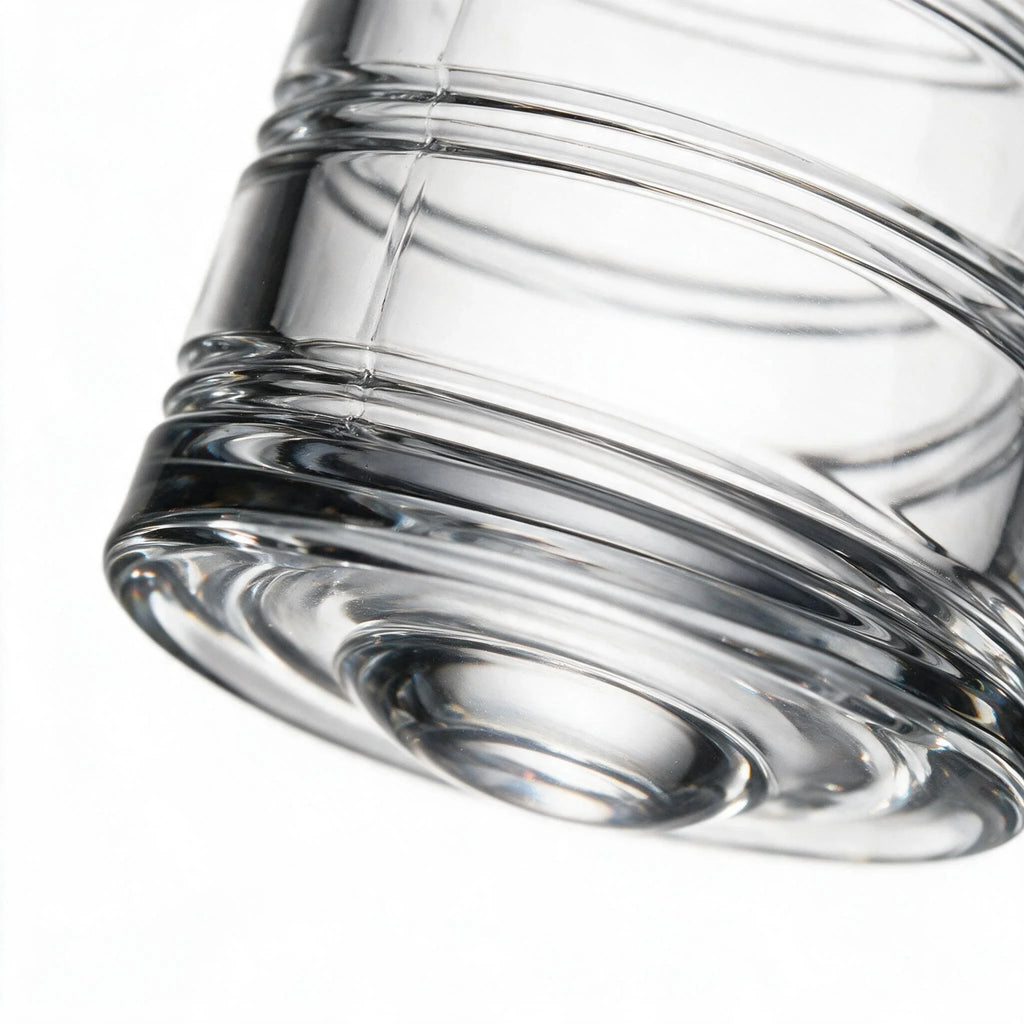 Helix clear whisky glass with a slanted rim and sweeping textured design