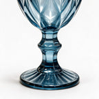 Marina blue cocktail glass with diamond cut facets and a short stem