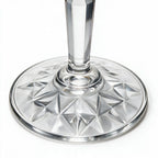 Lumina clear cocktail glass with a tall stem and geometric diamond cut bowl