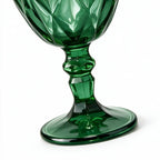 Sylvan green cocktail glass with diamond cut facets and a short stem