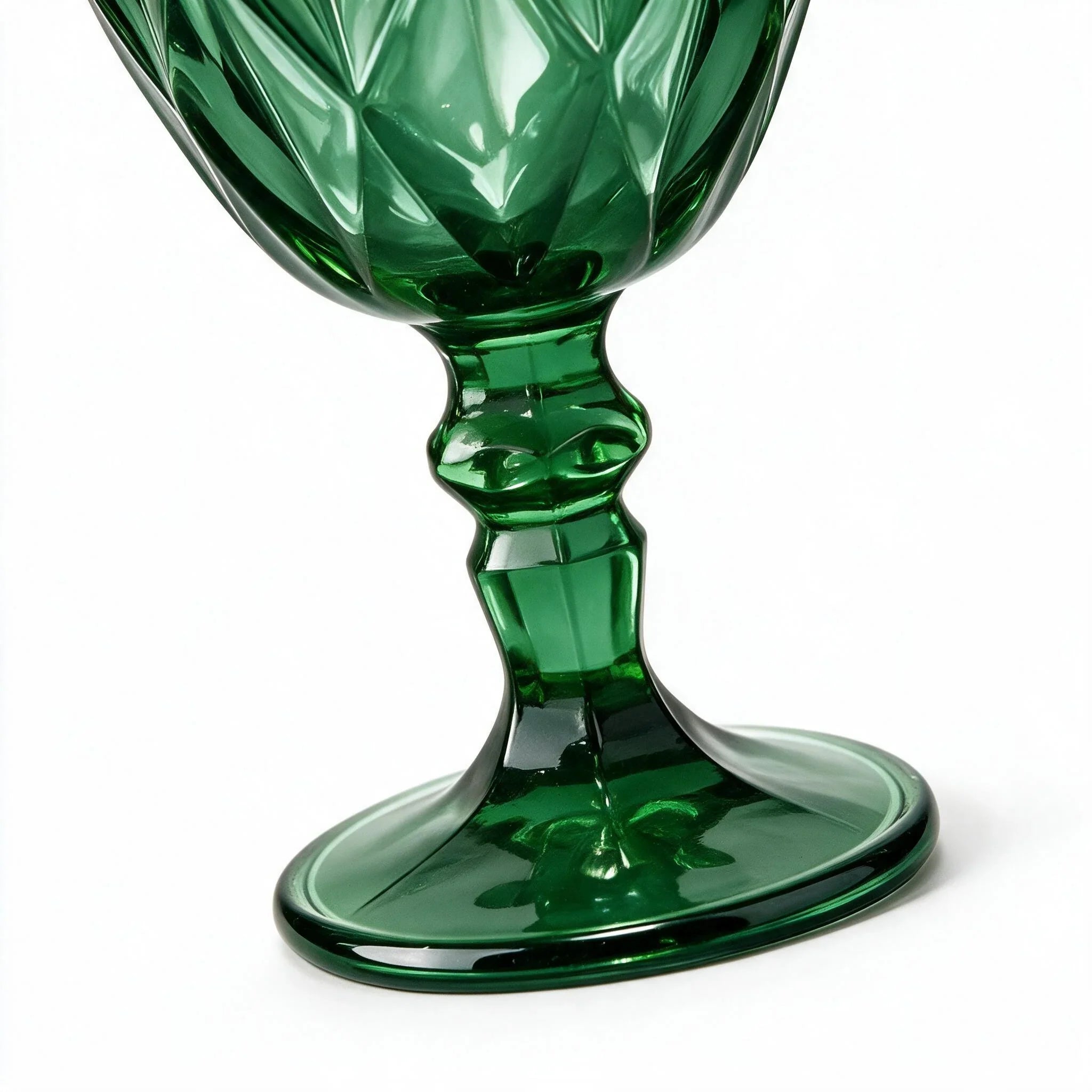 Sylvan green cocktail glass with diamond cut facets and a short stem