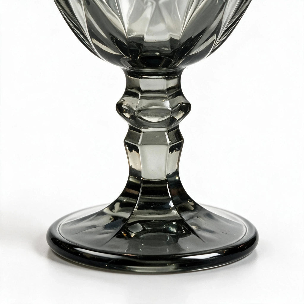Nocturne black cocktail glass with diamond cut facets and a short stem