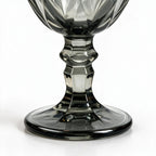 Nocturne black cocktail glass with diamond cut facets and a short stem
