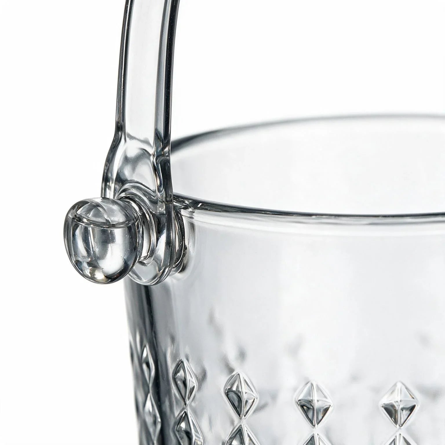 Valen clear glass ice bucket with diamond cut facets and a metal handle