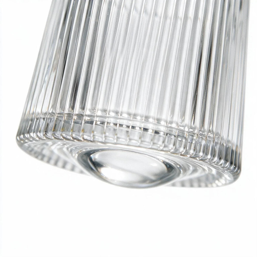 Coda clear whisky glass with a rotating base and ribbed texture