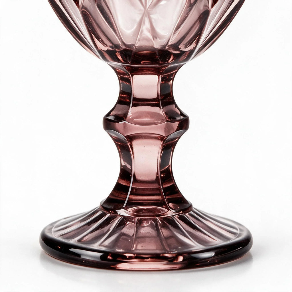 Amara dusky rose cocktail glass with diamond cut facets and a short stem
