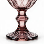 Amara dusky rose cocktail glass with diamond cut facets and a short stem