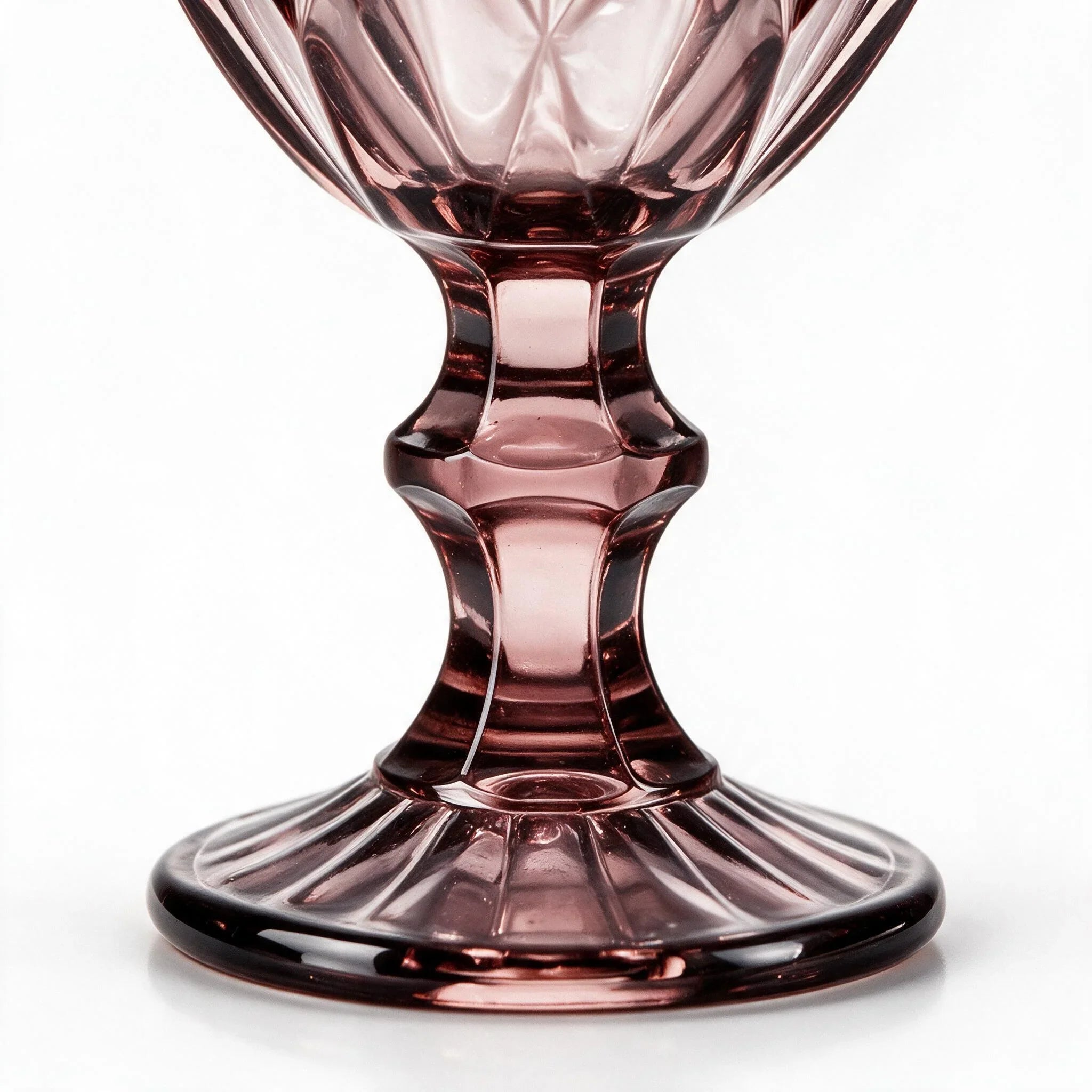 Amara dusky rose cocktail glass with diamond cut facets and a short stem