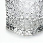 Astor clear whisky glass with diamond cut facets and a square base