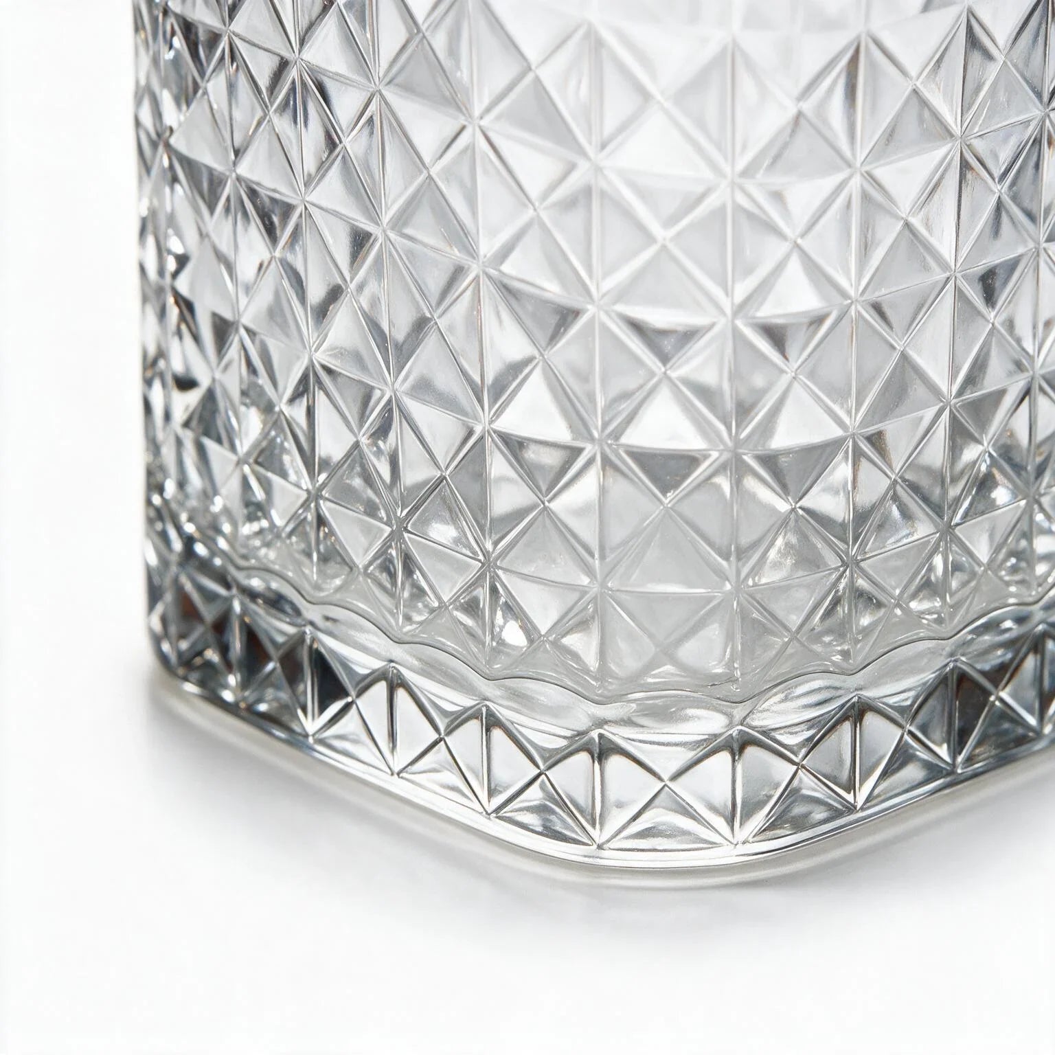 Astor clear whisky glass with diamond cut facets and a square base