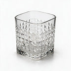 Astor clear whisky glass with diamond cut facets and a square base