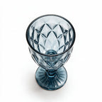 Marina blue cocktail glass with diamond cut facets and a short stem