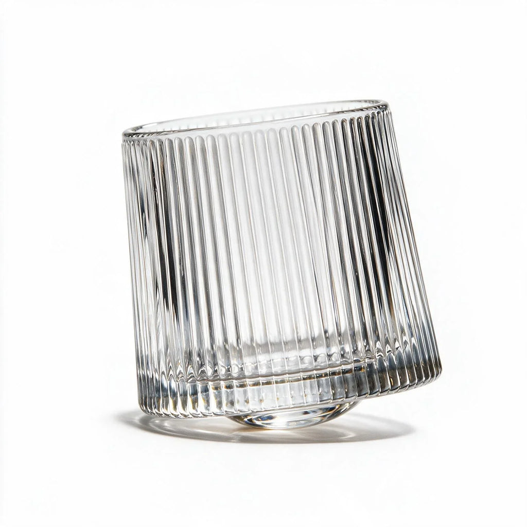 Coda clear whisky glass with a rotating base and ribbed texture