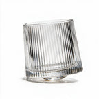 Coda clear whisky glass with a rotating base and ribbed texture
