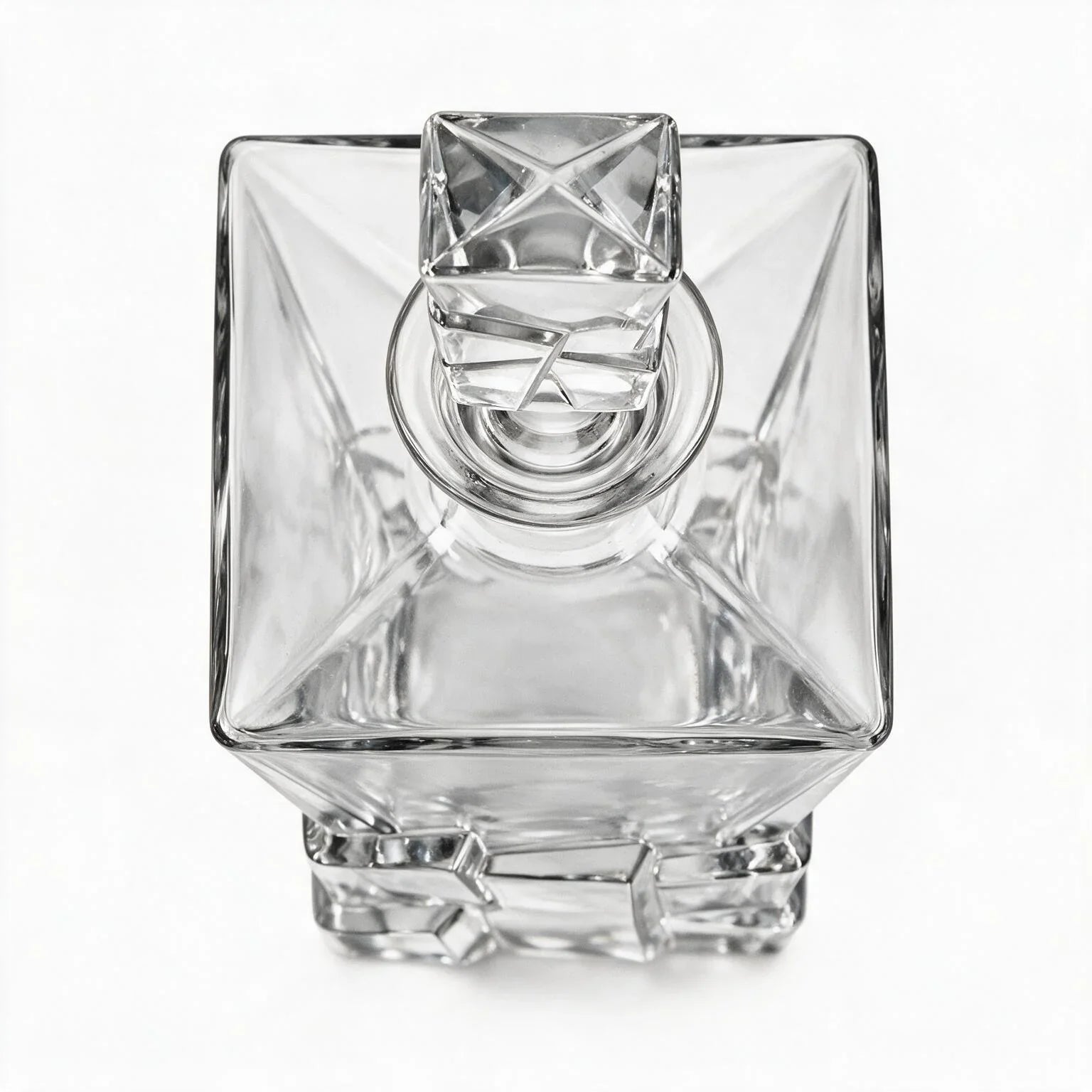 Vanguard clear glass whisky decanter with a bold geometric base and matching stopper