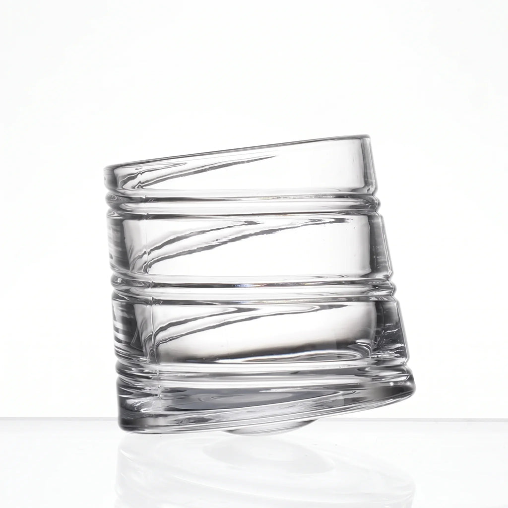 Helix clear whisky glass with a slanted rim and sweeping textured design