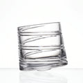 Helix clear whisky glass with a slanted rim and sweeping textured design