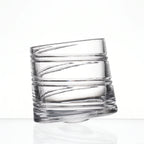 Helix clear whisky glass with a slanted rim and sweeping textured design