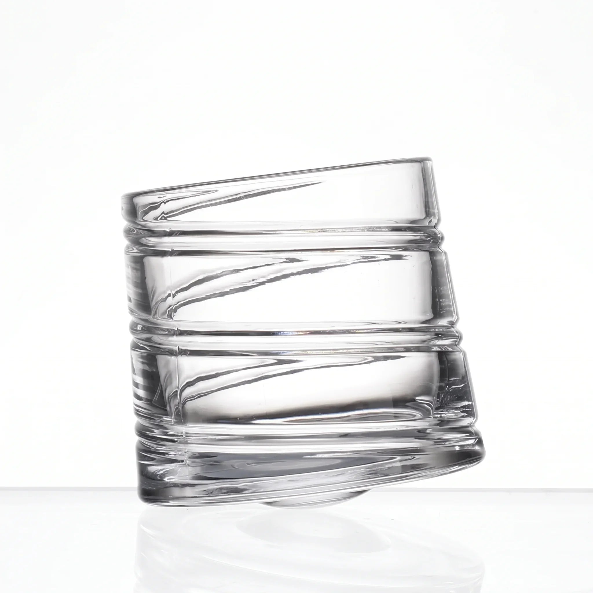Helix clear whisky glass with a slanted rim and sweeping textured design