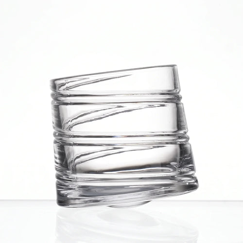 Helix clear whisky glass with a slanted rim and sweeping textured design