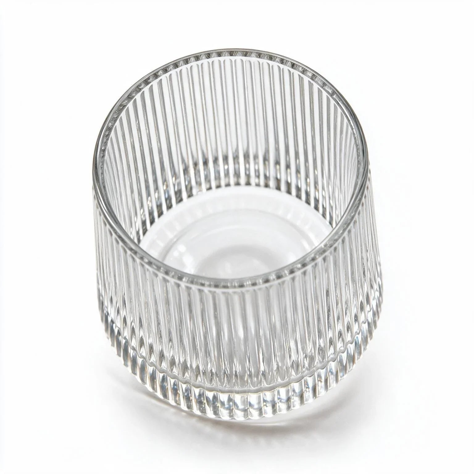 Coda clear whisky glass with a rotating base and ribbed texture