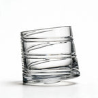 Helix clear whisky glass with a slanted rim and sweeping textured design