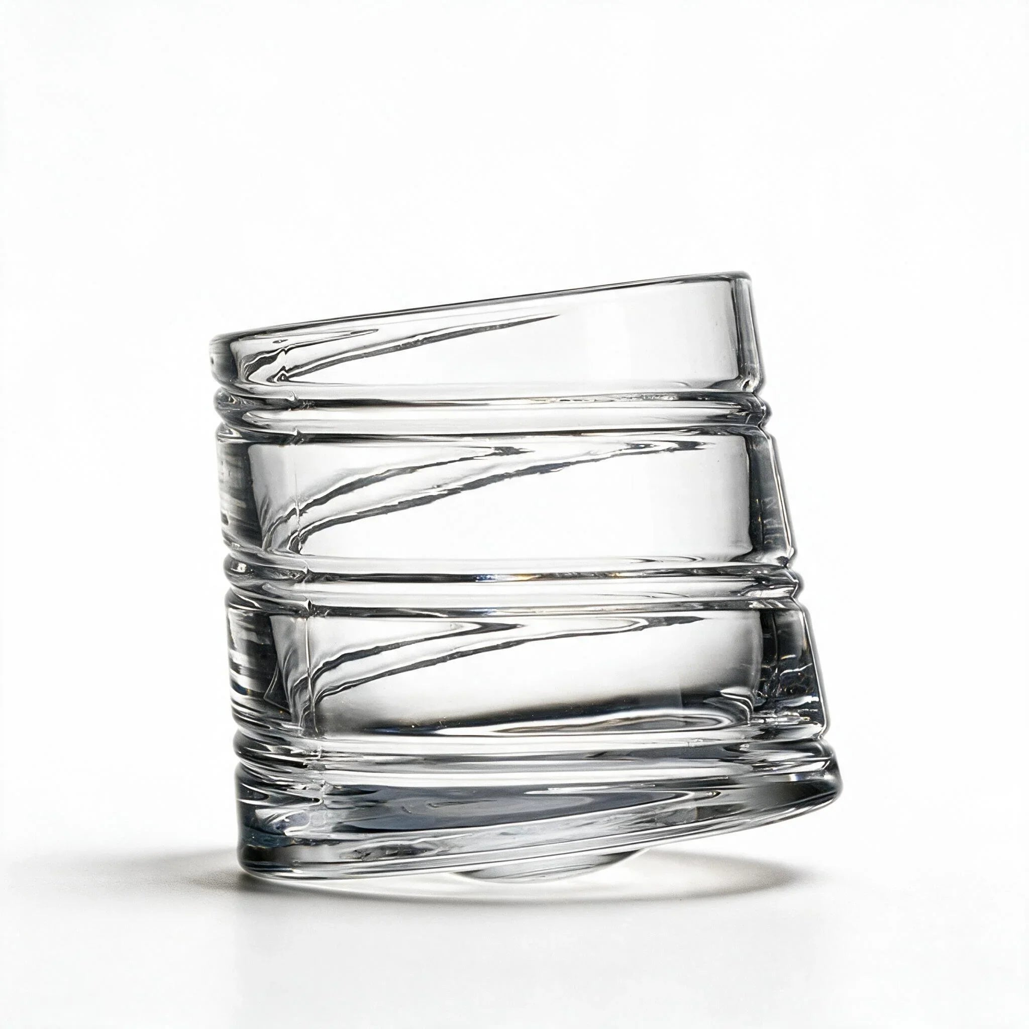 Helix clear whisky glass with a slanted rim and sweeping textured design