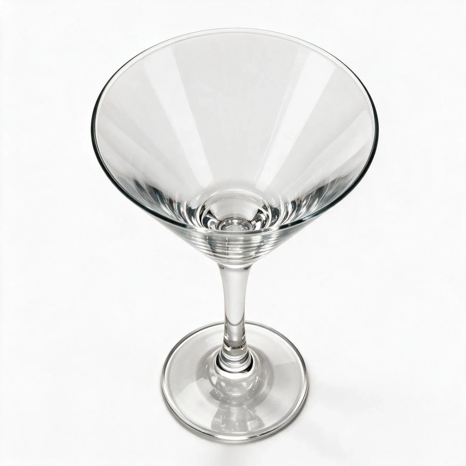 Vesper clear cocktail glass with star cut facets and a classic martini bowl 