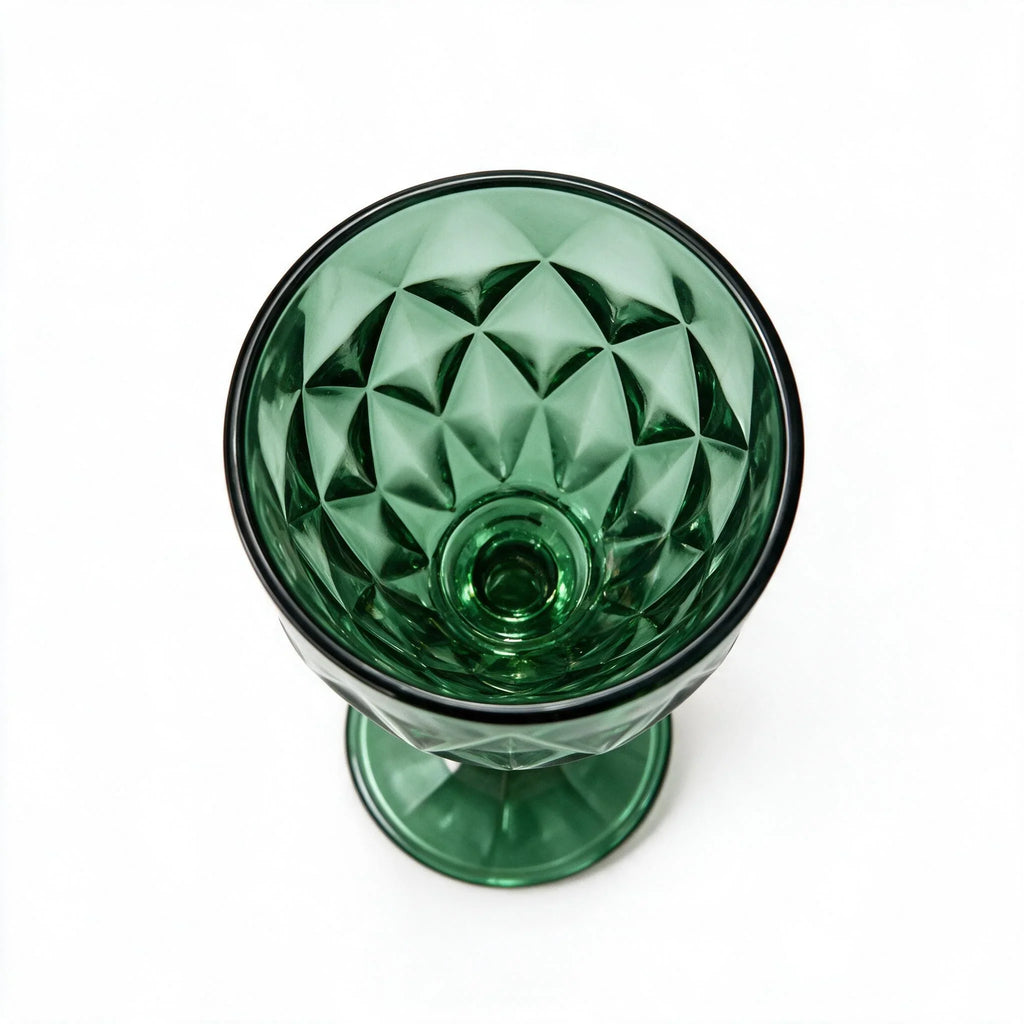 Sylvan green cocktail glass with diamond cut facets and a short stem