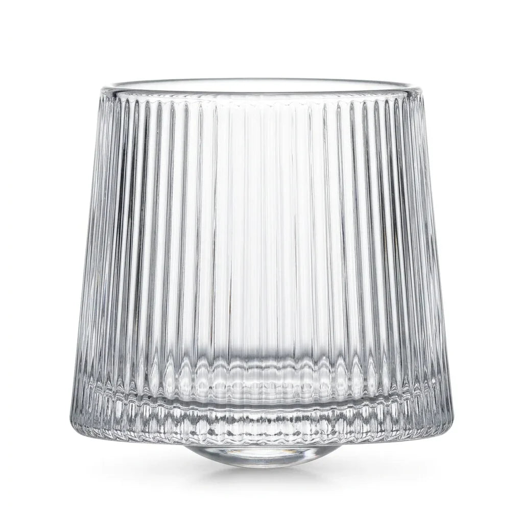 Coda clear whisky glass with a rotating base and ribbed texture