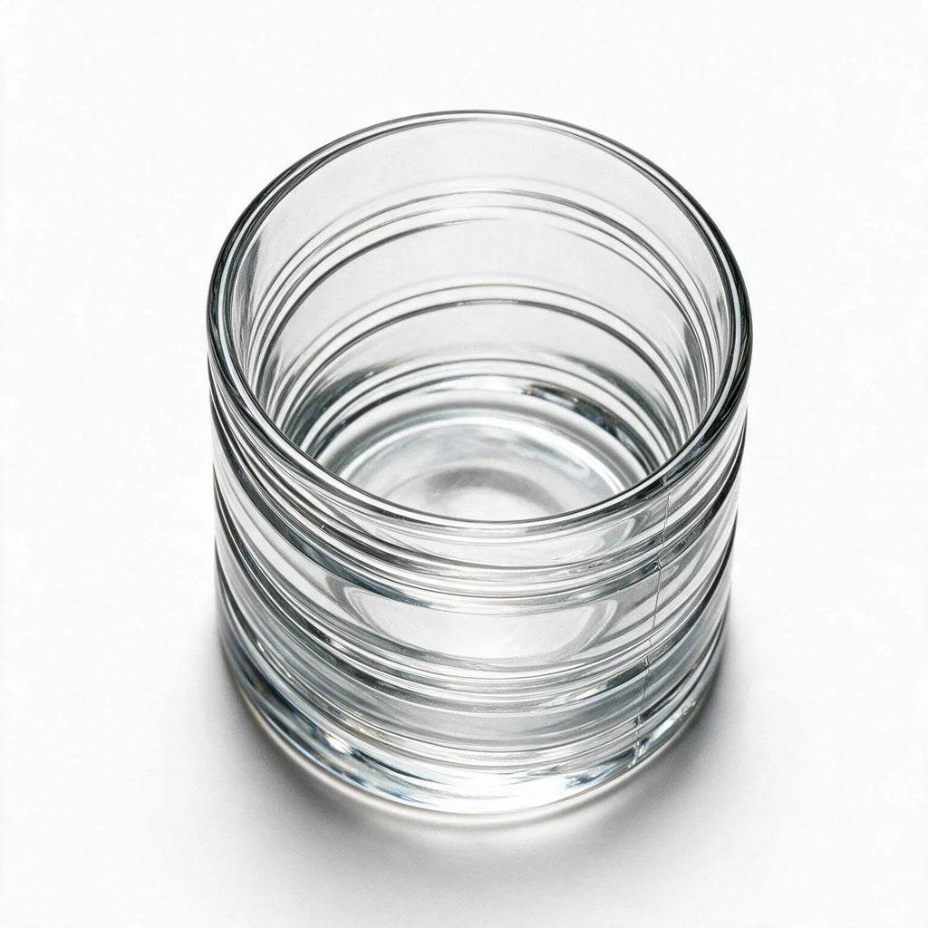 Helix clear whisky glass with a slanted rim and sweeping textured design