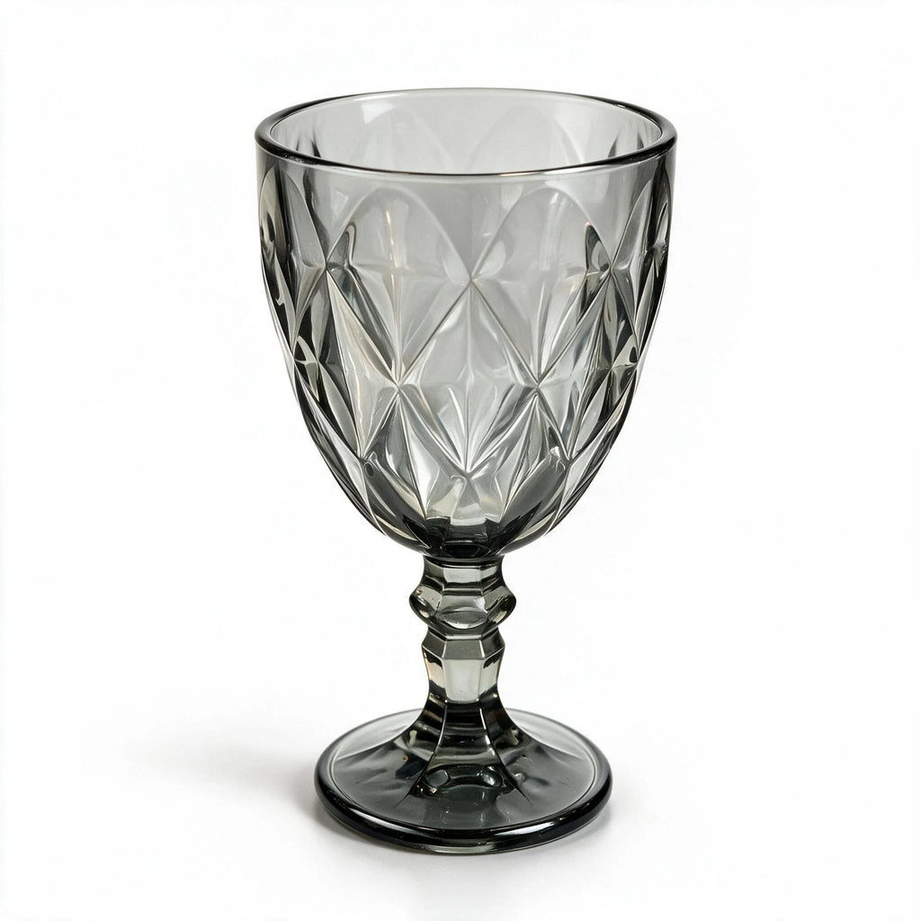 Nocturne black cocktail glass with diamond cut facets and a short stem