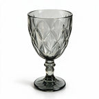 Nocturne black cocktail glass with diamond cut facets and a short stem