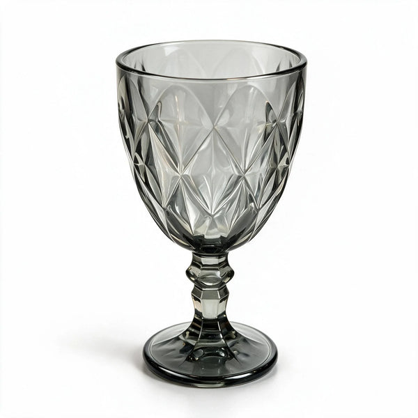 Nocturne black cocktail glass with diamond cut facets and a short stem