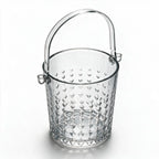 Valen clear glass ice bucket with diamond cut facets and a metal handle