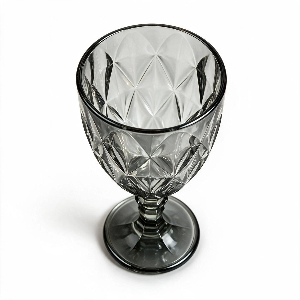 Nocturne black cocktail glass with diamond cut facets and a short stem