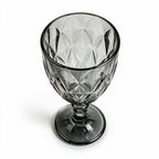 Nocturne black cocktail glass with diamond cut facets and a short stem