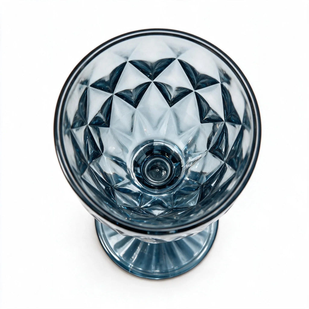 Marina blue cocktail glass with diamond cut facets and a short stem