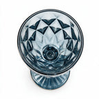Marina blue cocktail glass with diamond cut facets and a short stem
