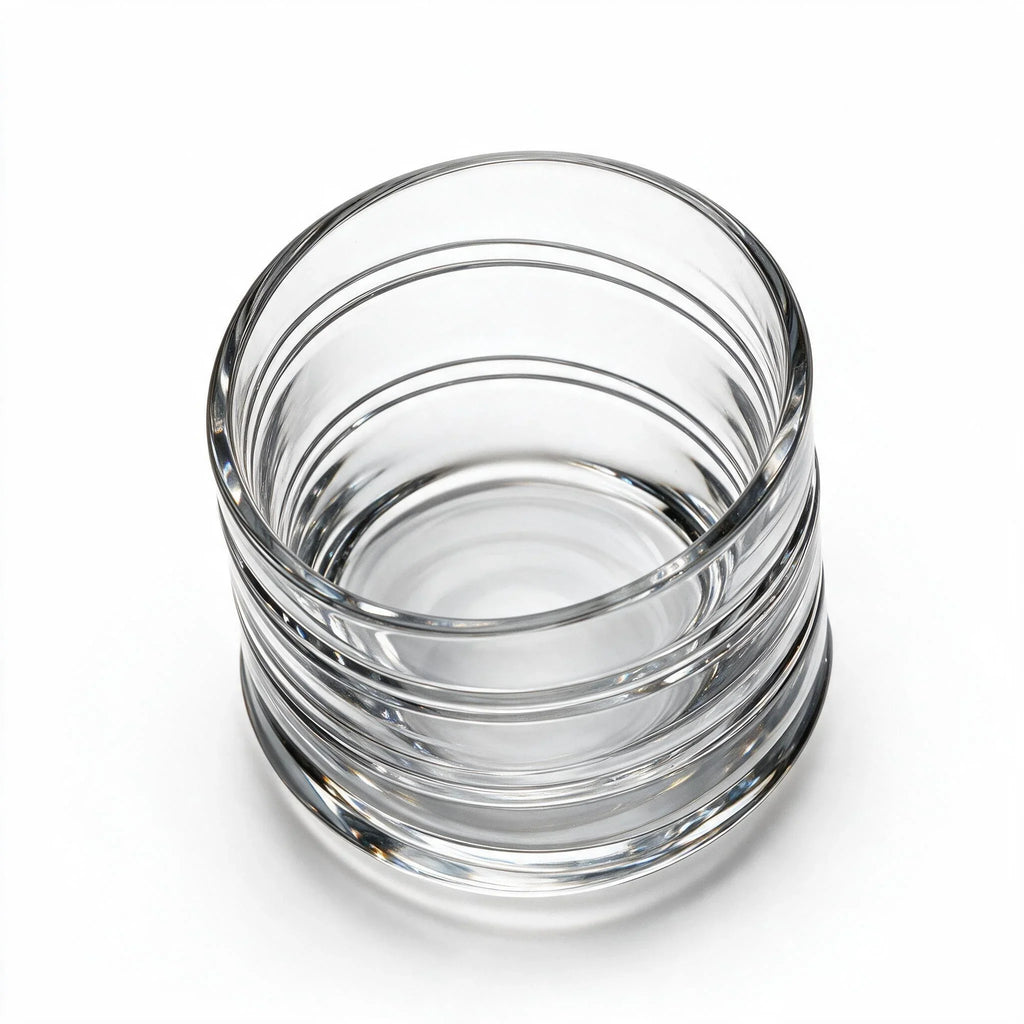 Helix clear whisky glass with a slanted rim and sweeping textured design