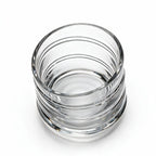 Helix clear whisky glass with a slanted rim and sweeping textured design