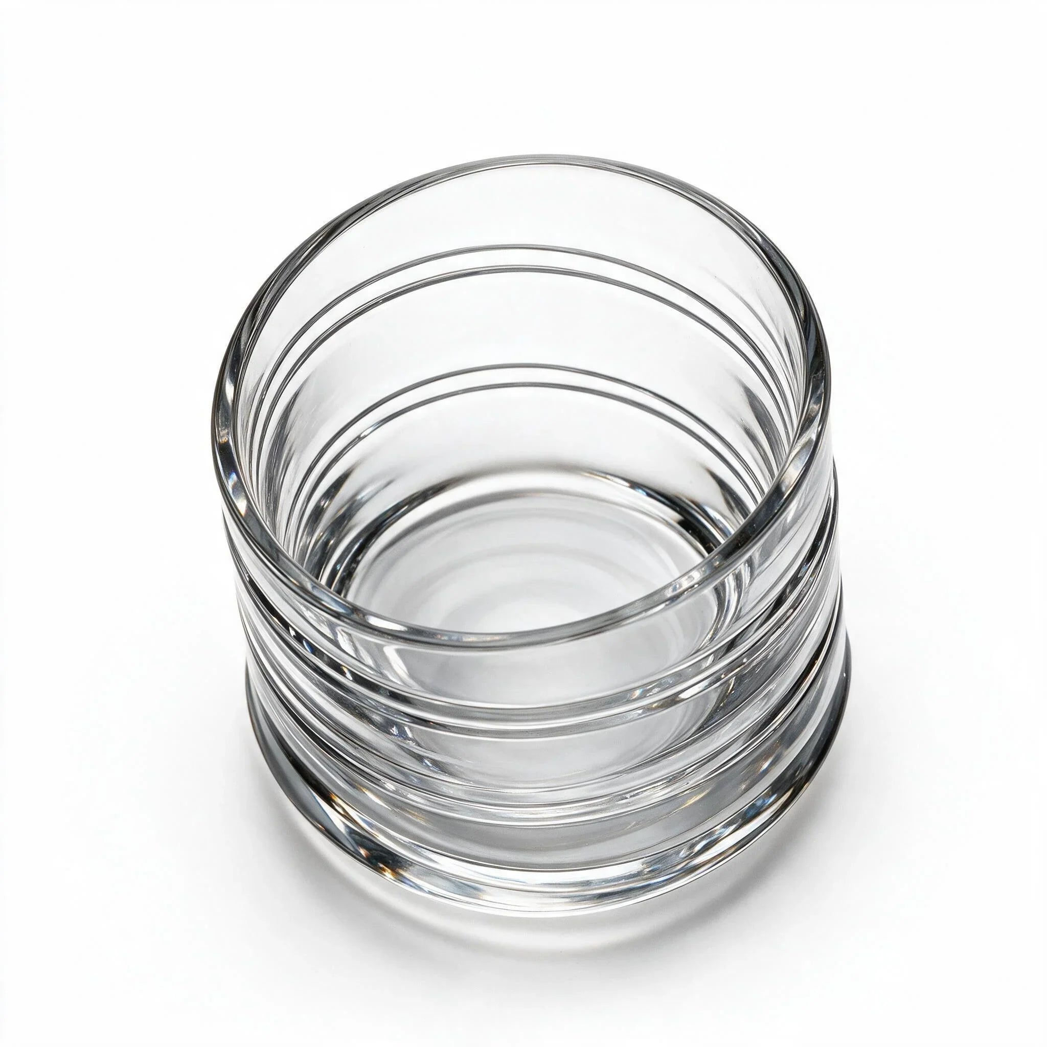 Helix clear whisky glass with a slanted rim and sweeping textured design