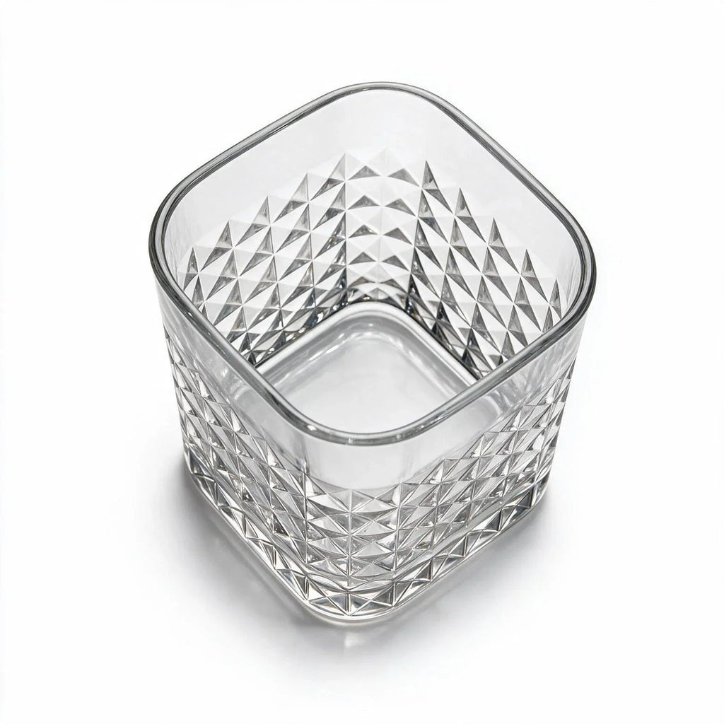 Astor clear whisky glass with diamond cut facets and a square base