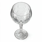 Lumina clear cocktail glass with a tall stem and geometric diamond cut bowl